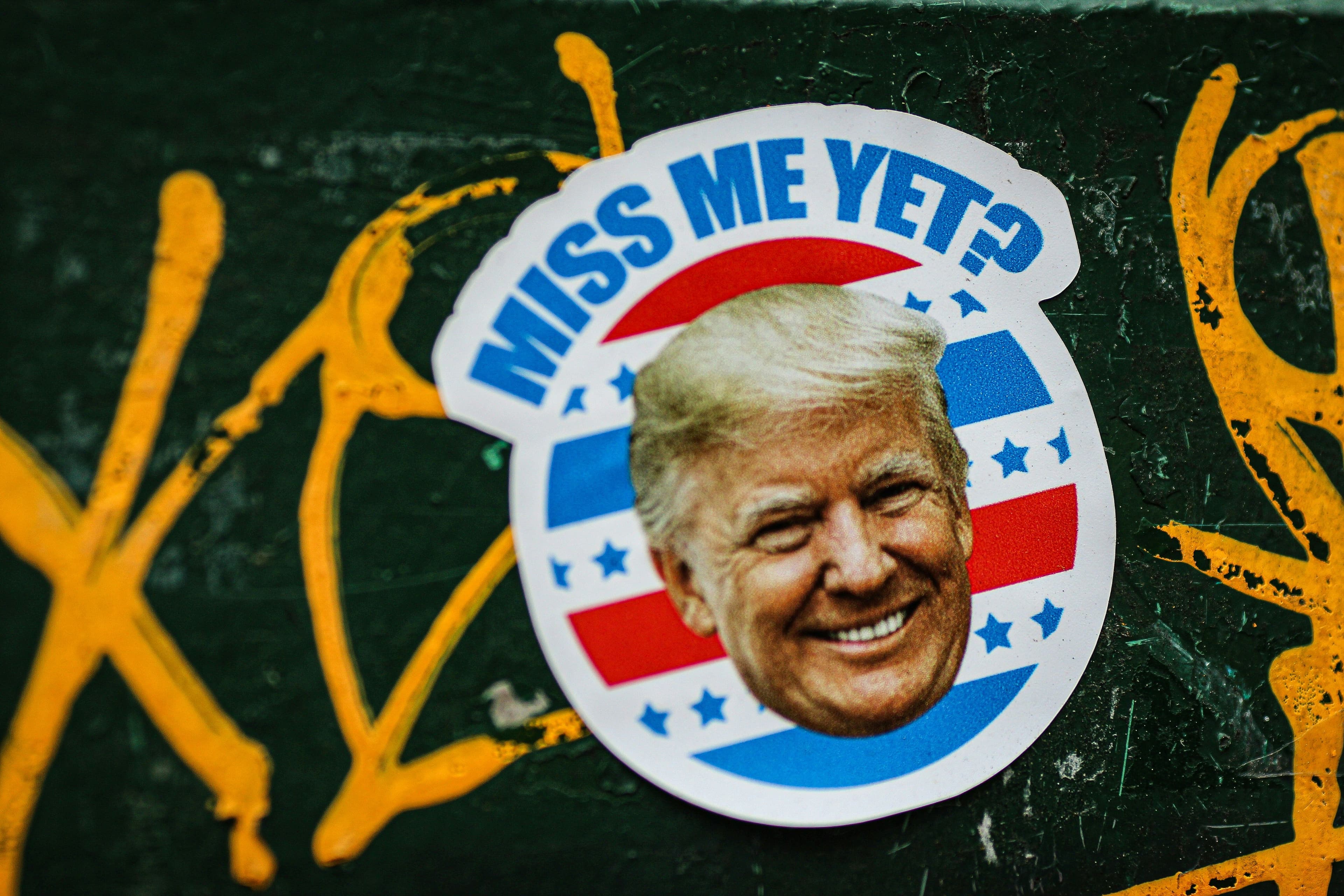 Main Image: Donald Trump label pin written "Miss Me Yet?"