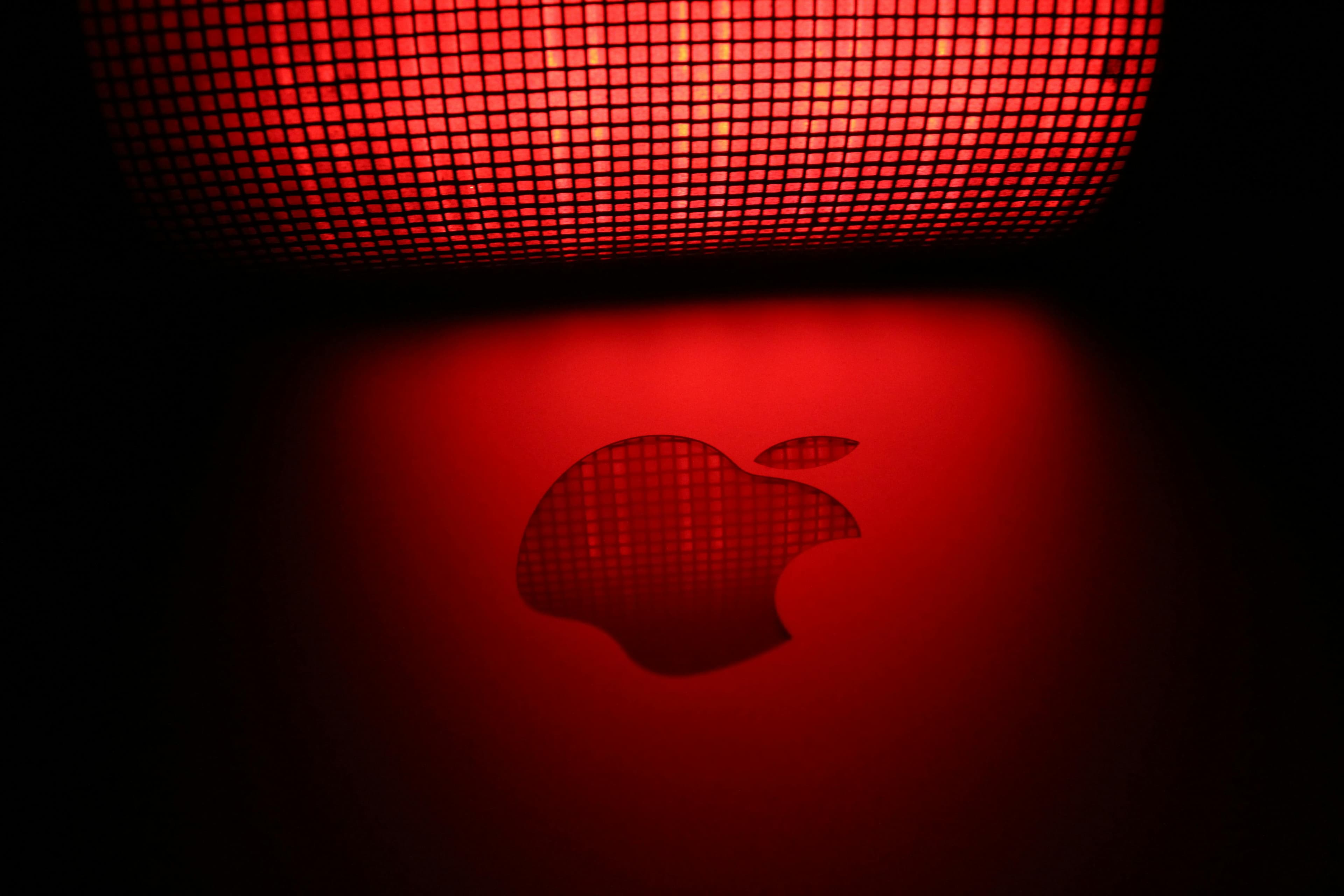 Apple logo in a red backdrop